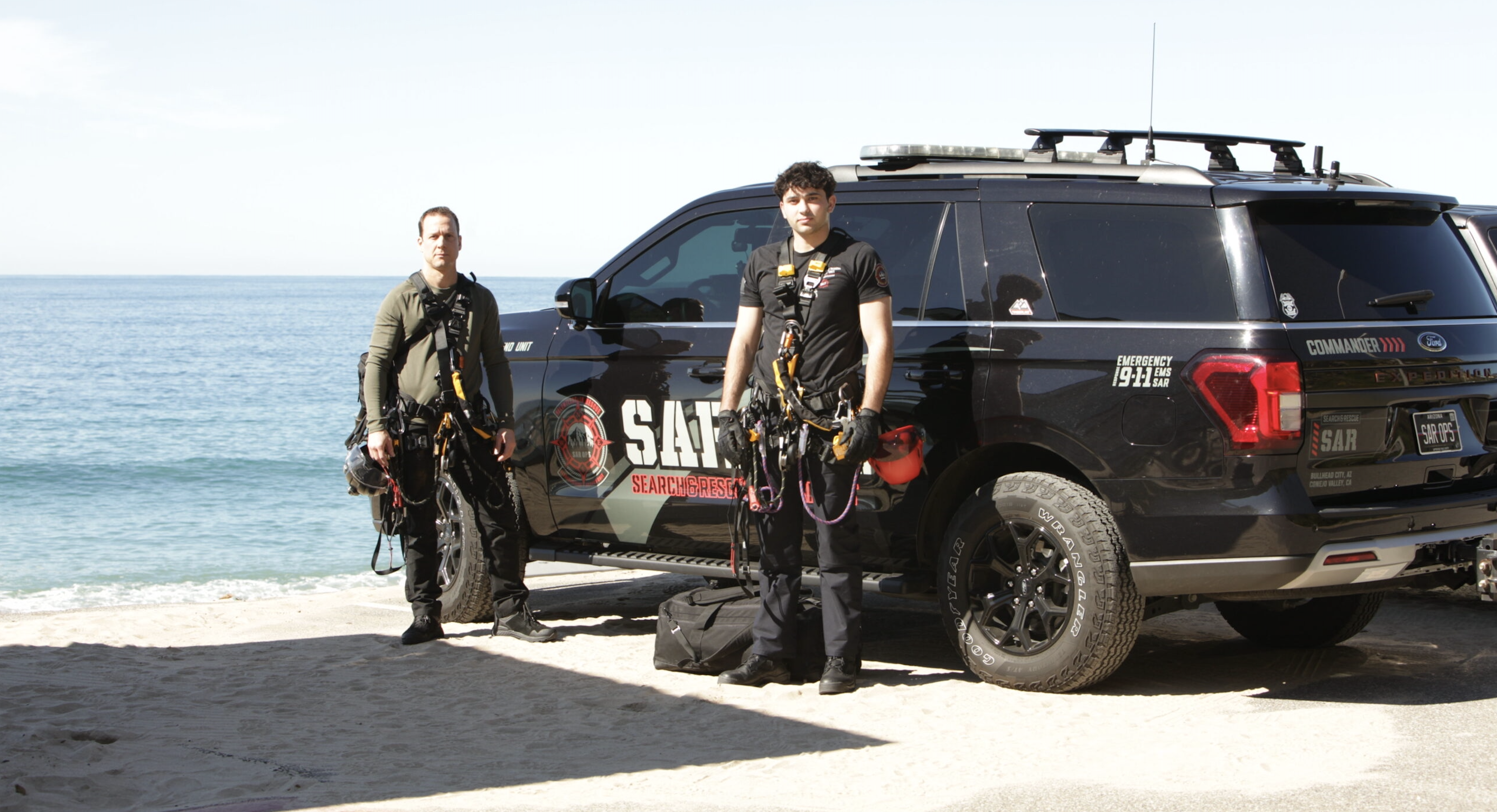 SAR OPS team members in front of command vehicle